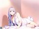 Anime girl with long blue hair laying on a bed.