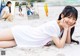 A woman laying on the sand on a beach.